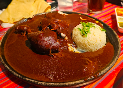 Guelaguetza signature dishes Mole Negro
Enchiladas Oaxaquenas
Festival de Moles